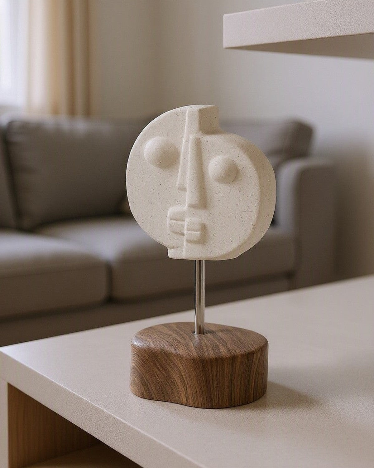 Two-Faced Ceramic Ornament styled in a living room
