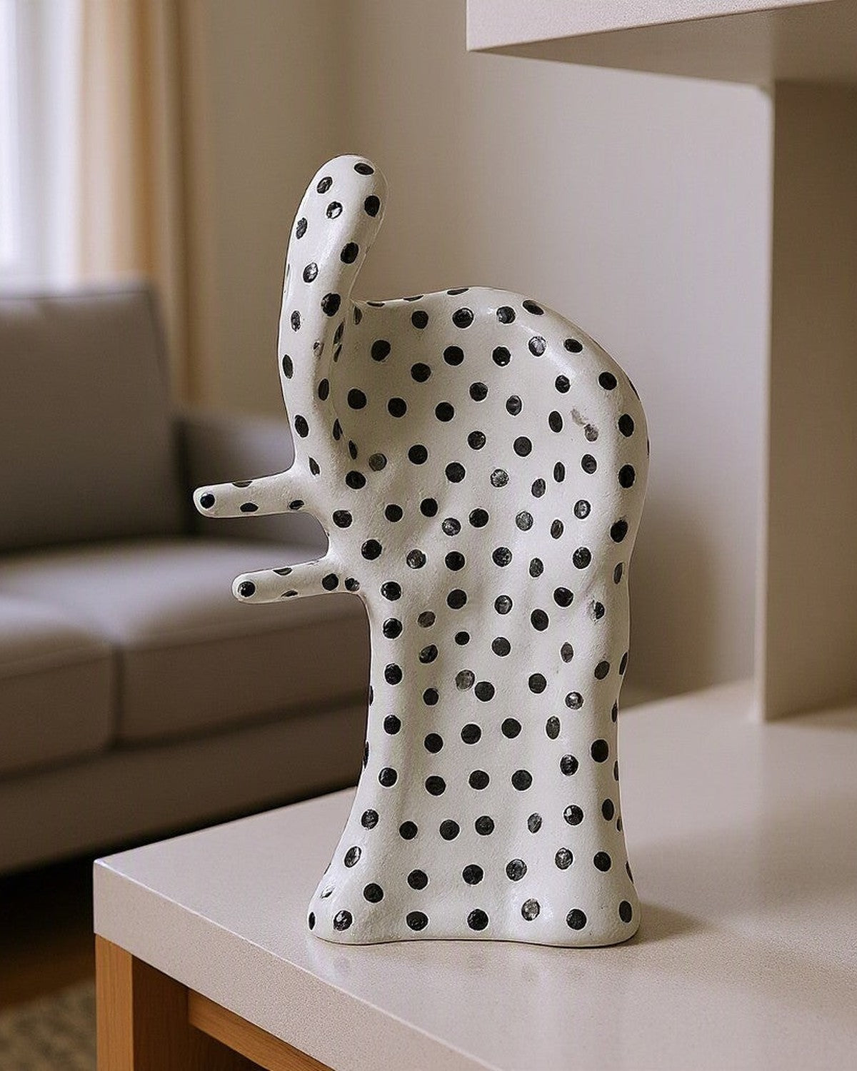 Dot Aggregation Ceramic Sculpture styled in a living room