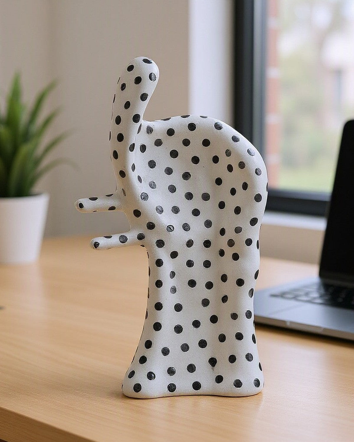 Dot Aggregation Ceramic Sculpture on a desk