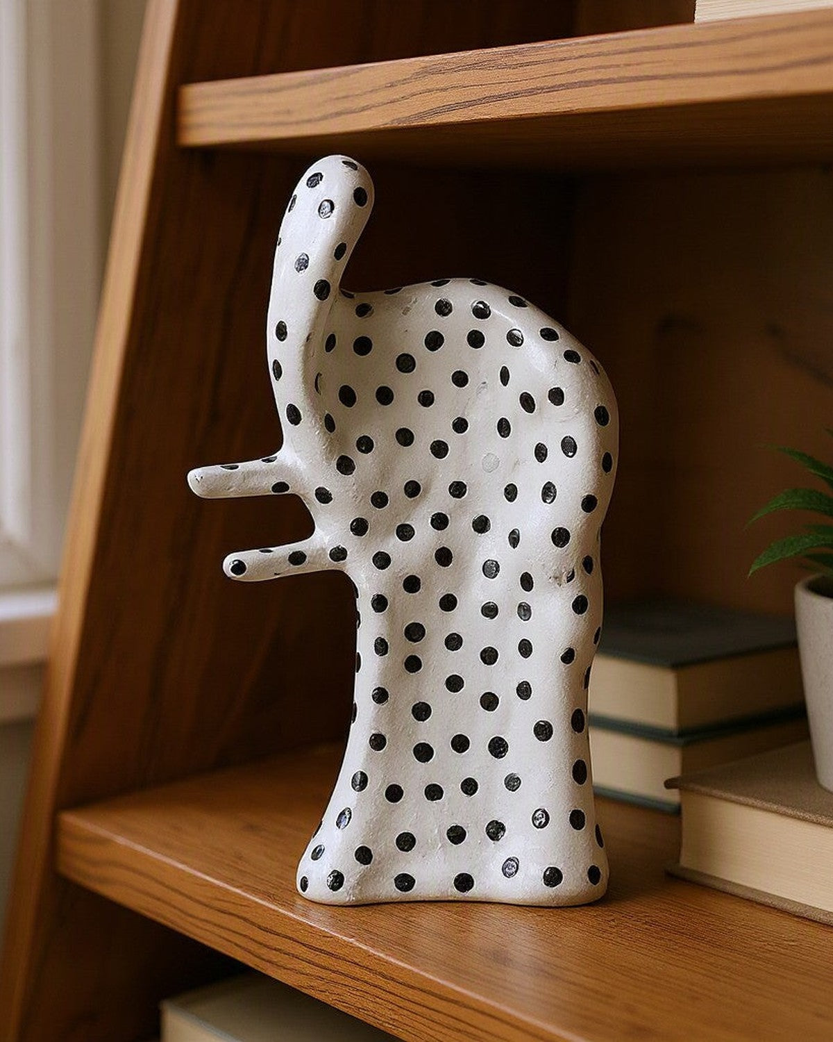 Dot Aggregation Ceramic Sculpture on a shelf