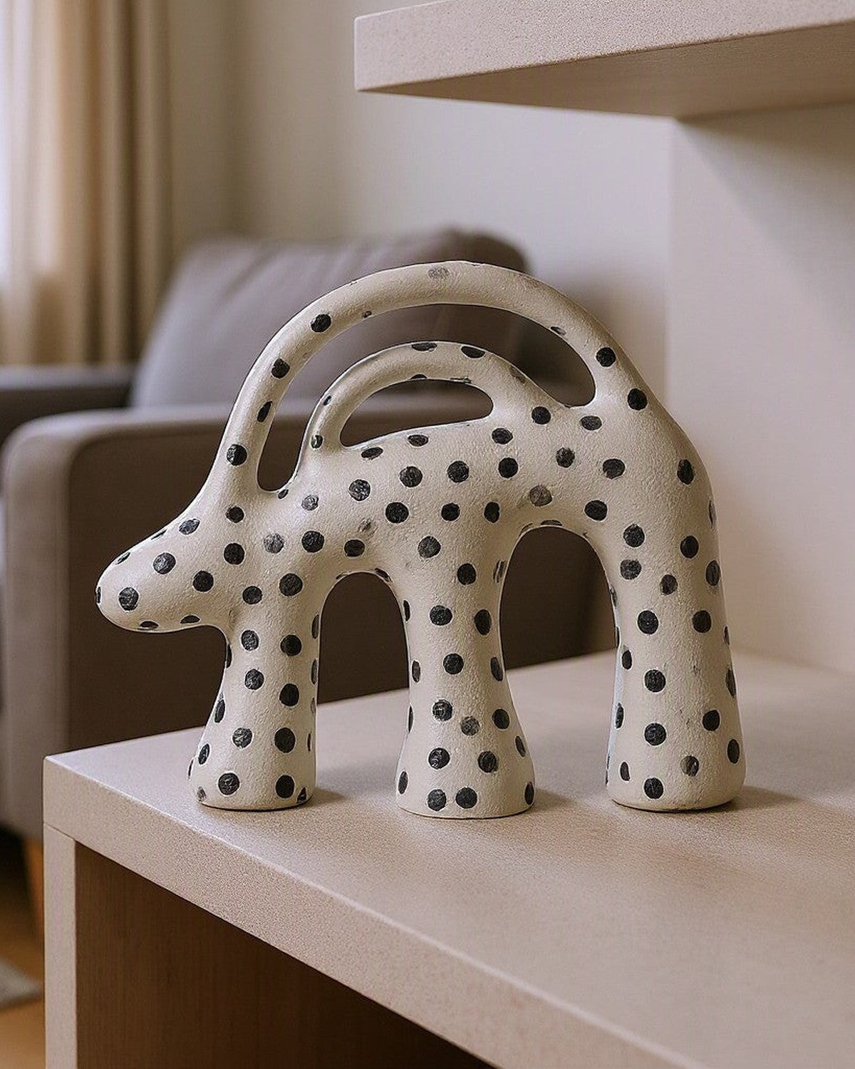 Dot Aggregation Ceramic Sculpture styled in a living room