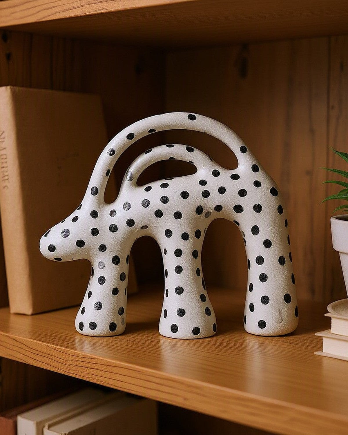 Dot Aggregation Ceramic Sculpture on a shelf